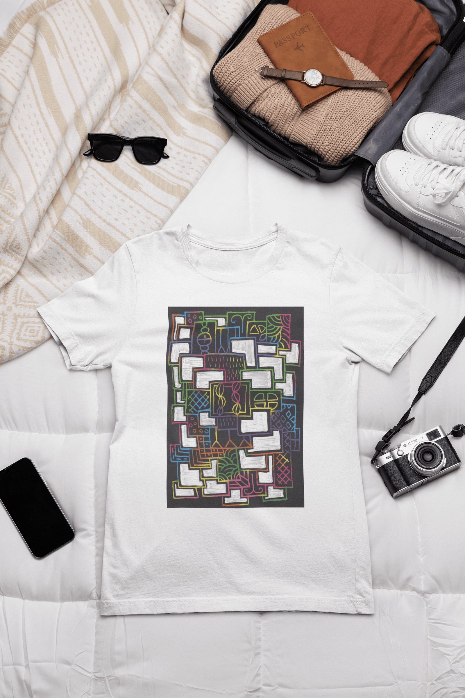 outfit-mockup-of-a-bella-canvas-t-shirt-placed-on-a-bed-next-to-a-vintage-camera-m37445